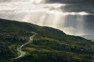 Road, dirt road on Ireland's west coast with beams, Donegal, Ireland Road, dirt road on Ireland's west coast with beams, Donegal, Ireland